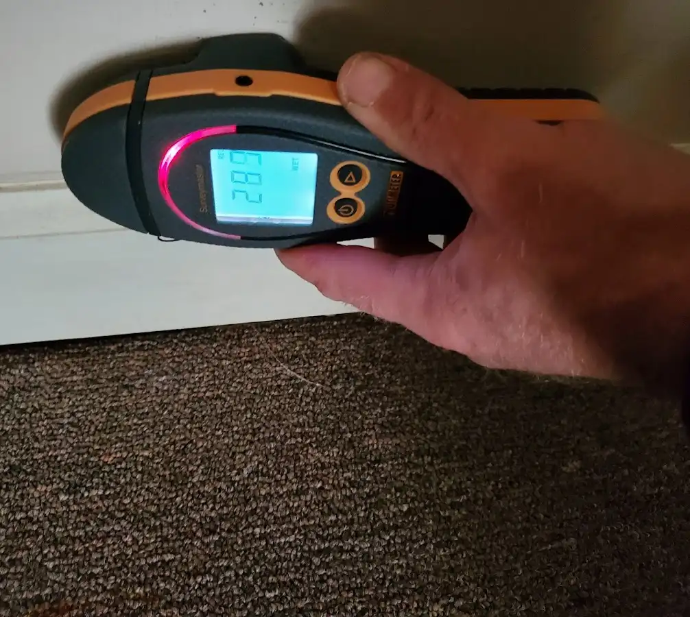 Moisture detection at baseboard during Storm Damage Restoration in Council Bluffs